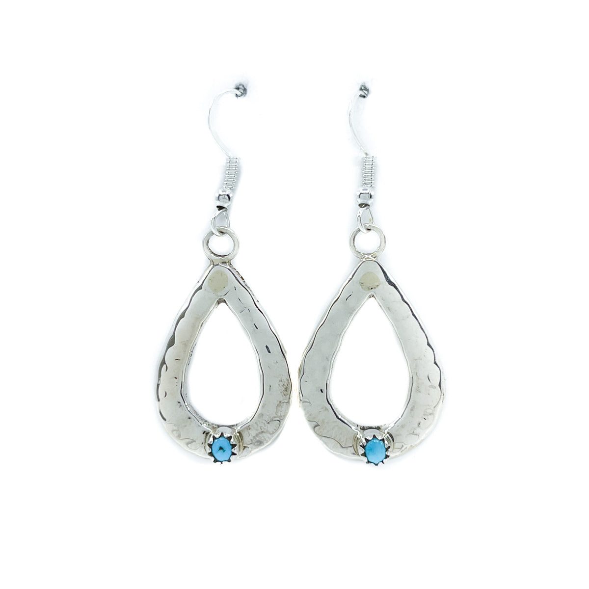 Stamped Sterling Silver &amp; Turquoise earrings, by Pauline Nelson, Diné jeweler
Measures approximately 1.25 inches long x.75&nbsp;inches wide&nbsp;&amp; dangle 1.75 inches from earlobe&nbsp;
Sterling Silver wires