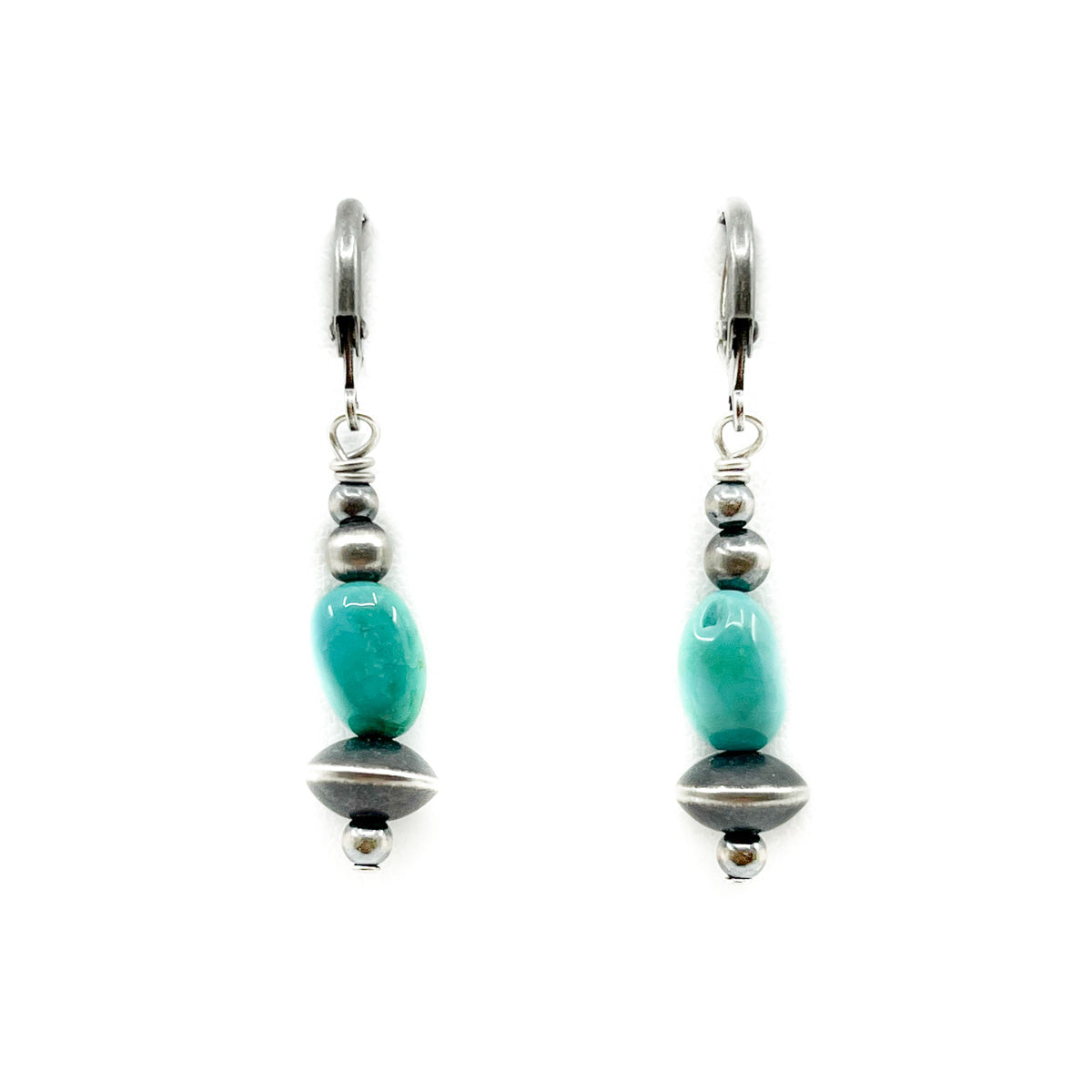 Sterling Silver Bead earrings with Turquoise
Measures approximately 1.0 inches long x.25&nbsp;inches wide&nbsp;&amp; dangle 1.50 inches from earlobe&nbsp;
Sterling Silver wires
