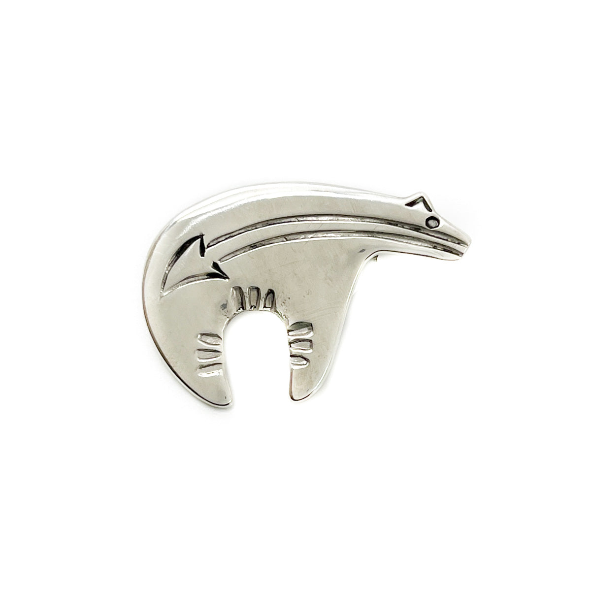 Sterling Silver&nbsp;Bear Pin&nbsp;by Allison Manuelito, Diné silversmith Hand stamped on the back of pendant with artist's&nbsp;initials Measures approximately 1.5&nbsp;inches wide x 1.0 inches long approximately 2.5 inches long