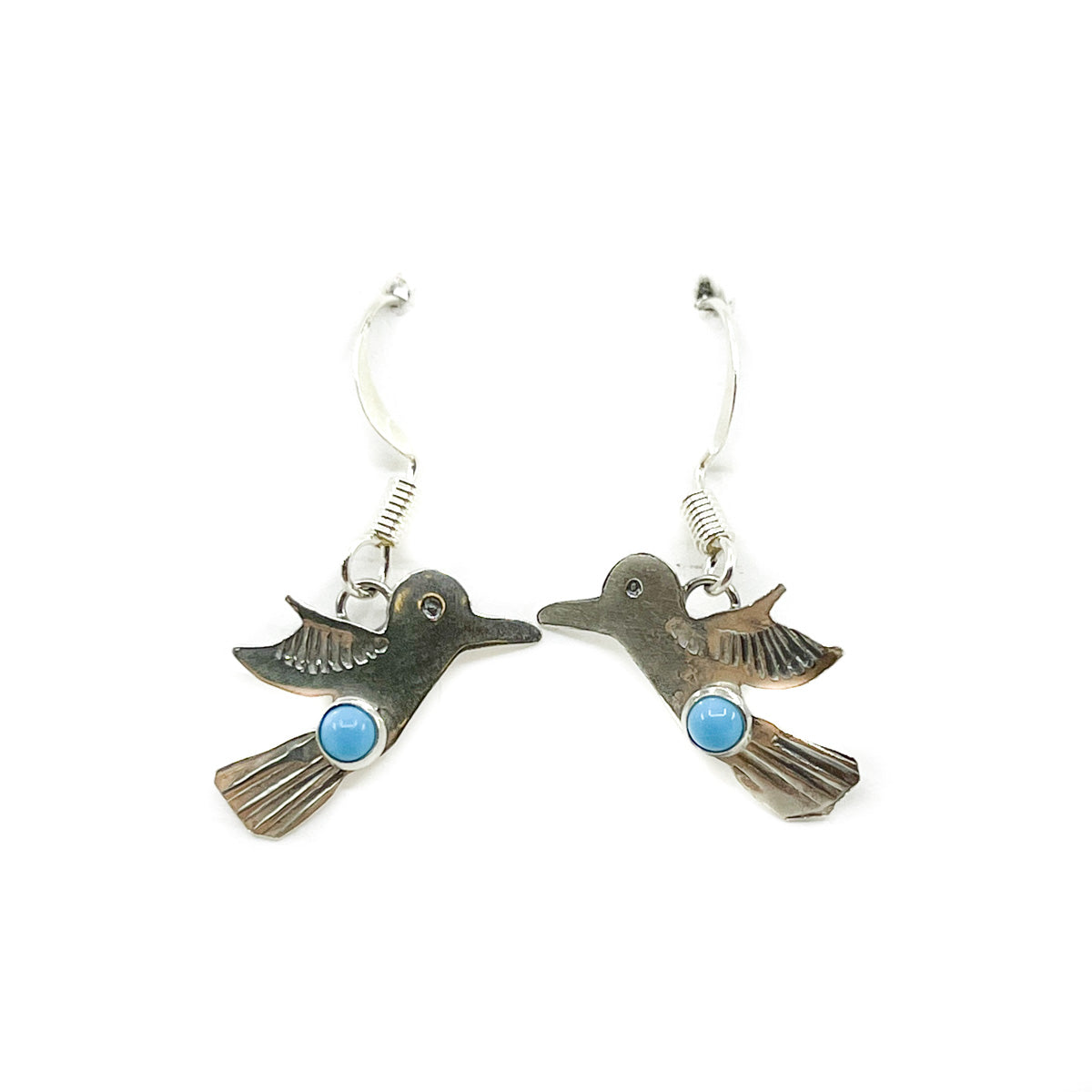 Made by Dine artist Lucille Platero
Delicate earrings with sterling silver and turquoise
Earrings are approximately .75 inches long x .75 inches wide and dangle .75 inches from earlobe
Sterling Silver wires