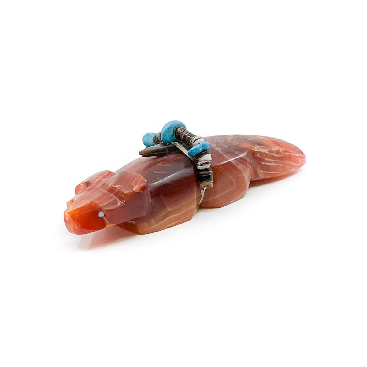 Carnelian Badger carving with turquoise inlaid eyes, and turquoise and shell bundle&nbsp; Hand carved by Zuni artist, Kenric Laiwakete Measures approximately 3.5 inches long x 1 inch wide x 1 inch high