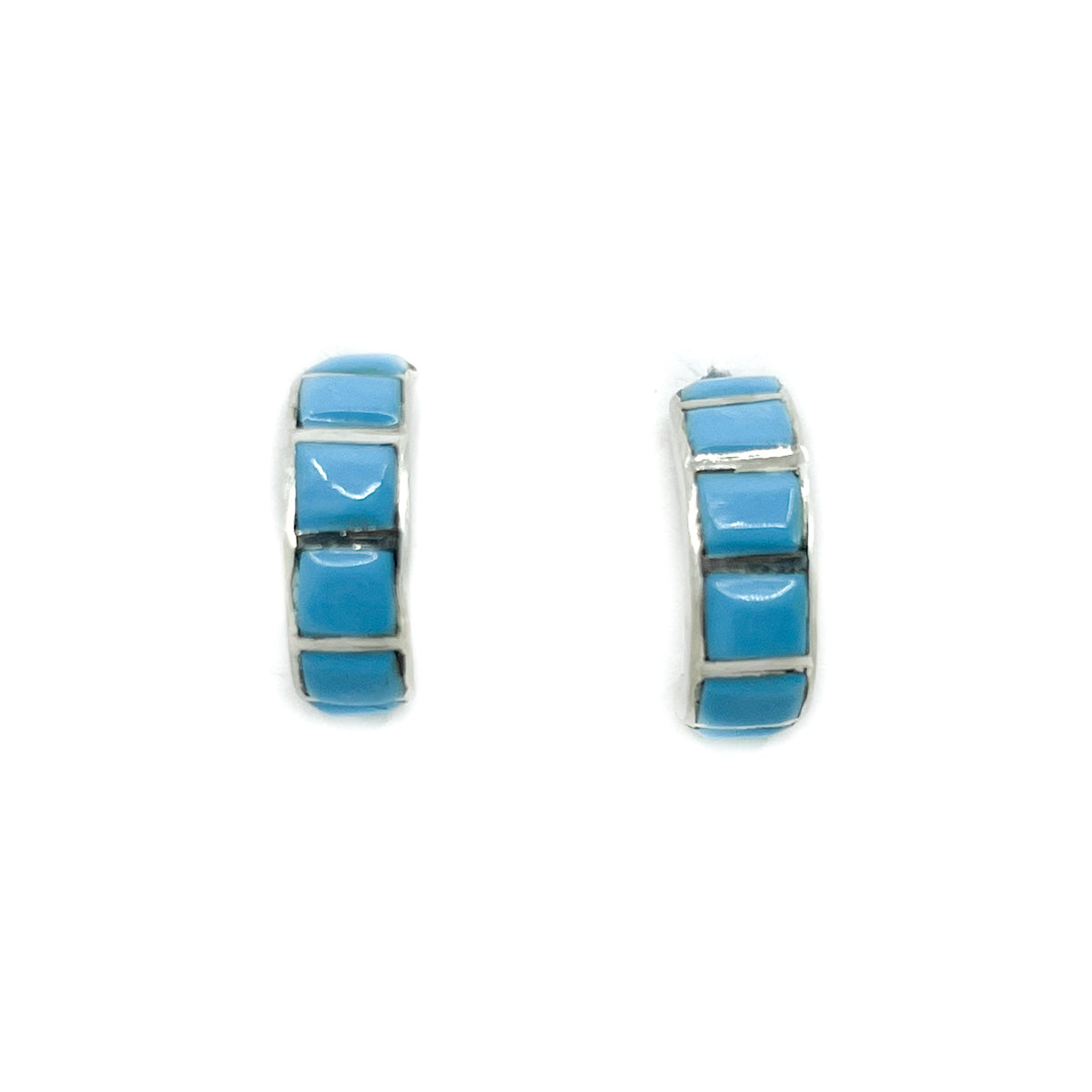 Sterling&nbsp;Silver and Turquoise channel inlay hoop&nbsp;earrings
Handcrafted by Zuni&nbsp;artisans
Earrings are approximately .75 inch long&nbsp;x .25 inch wide&nbsp;

Sterling Silver posts and backs
