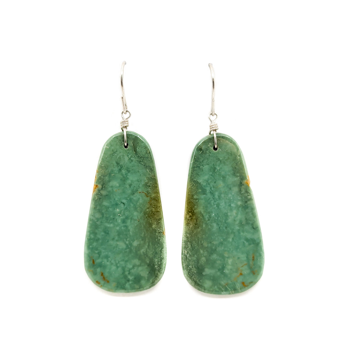 Hand crafted by Lester Abeyta, Santo Domingo Pueblo&nbsp;
Lightweight, comfortable turquoise slab earrings

Sterling silver wires
Stones measures approximately 1.5 inches long x .75 inches wide
Earrings dangle from earlobe approx. 2 inches
