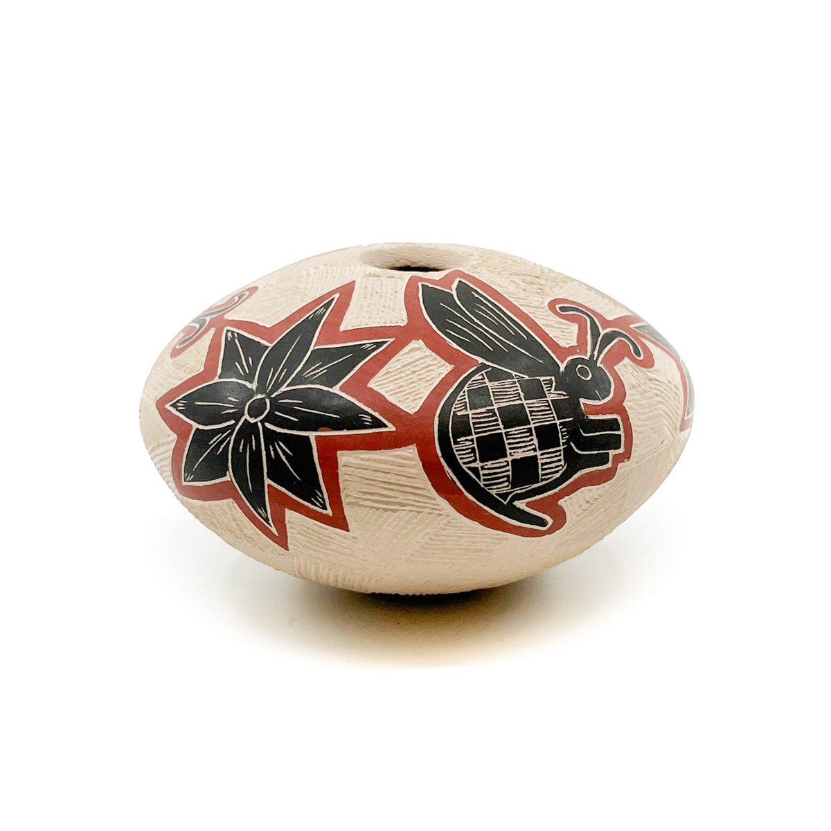 Handcrafted pot by Mata Ortiz artist&nbsp;Nallely Aldavas Measures approximately 3.25 inches high x 3.25 inches in diameter at widest circumference Mata Ortiz is a small village in the state of Chihuahua, Mexico, less than 100 miles from the US-Mexico border. The pueblo has a population of approximately 2,000 people and is within the municipality of Casa Grandes in a wide fertile valley, which has long been inhabited by indigenous people. The ancient ruins of Casas Grandes are located nearby