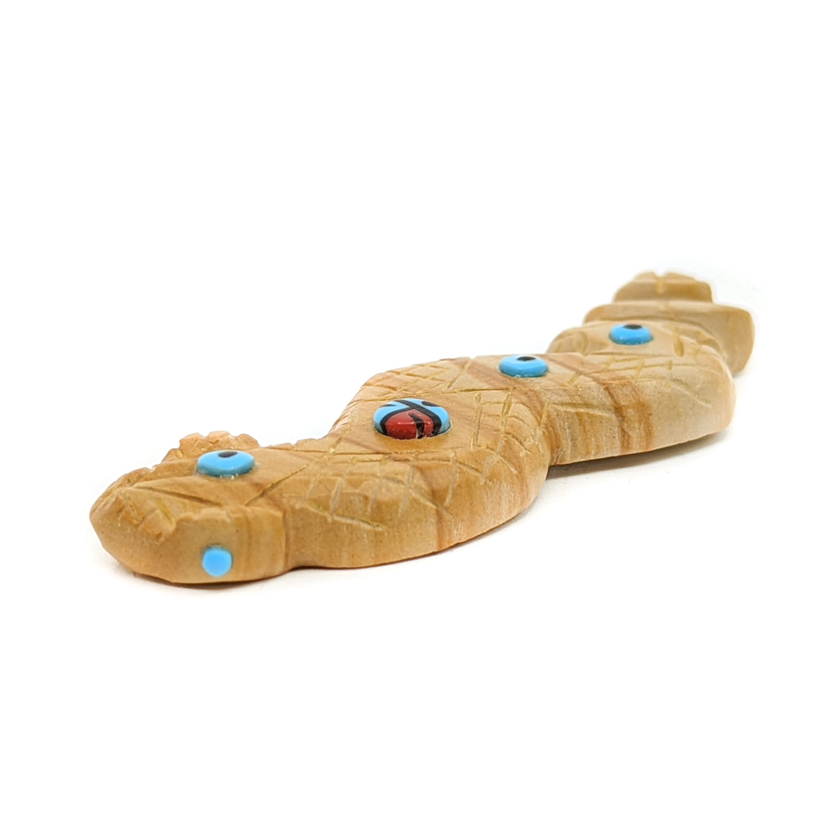 Dolomite Snake&nbsp;carving with Turquoise &amp; Jet eyes,&nbsp;Turquoise accents, and an inlaid Zuni Sunface design&nbsp;&nbsp; Hand carved by Zuni artist,&nbsp;Danette Laate Measures approximately 2.5 inches long x .75 inches wide x .25 inches high