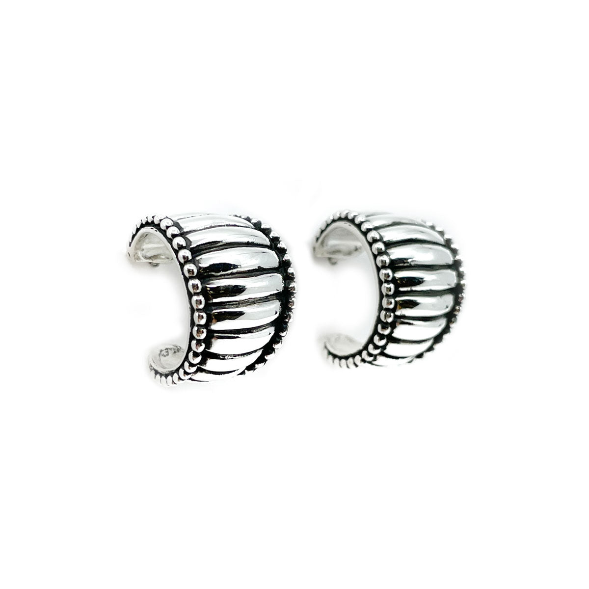 Sterling silver hoop earrings by Diné jeweler Tom Charlie
Beautifully detailed, heavy gauge silver with sterling silver posts and backs
Approximate dimensions: Hoops are .75 inches in diameter and 1/8 of an inch to 5/8 of an inch wide at widest area