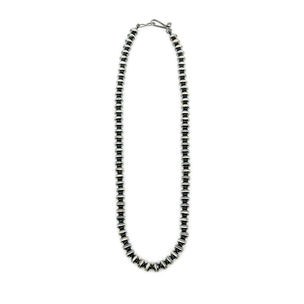 Handmade sterling silver beads by Michelle Jameson, Diné jeweler One 18 inch long strand of handcrafted, burnished beads strung on chain Handmade sterling silver hook and eye clasp Each bead measure approx. 3/8th of an inch
