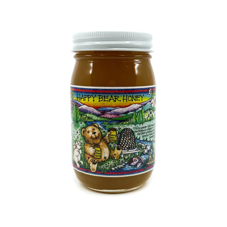 Raw unfiltered Arizona mesquite honey in a glass jar with a happy bear on the label