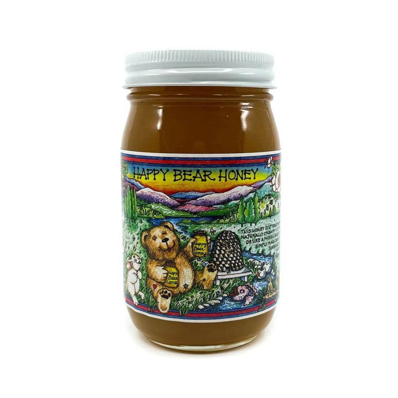 Raw unfiltered Arizona wildflower honey in a glass jar with a happy bear on the label