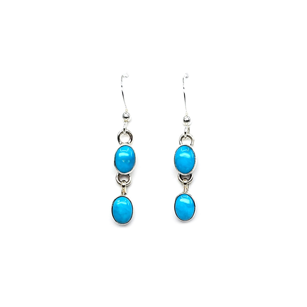 Hand crafted by Navajo artist Rose S. Paxton
Oval cabochons of clear blue Sleeping Beauty turquoise set in sterling silver bezels
Sterling silver French hooks and findings
Earrings are approx 1 inch long and dangle from ear 1.5 inches