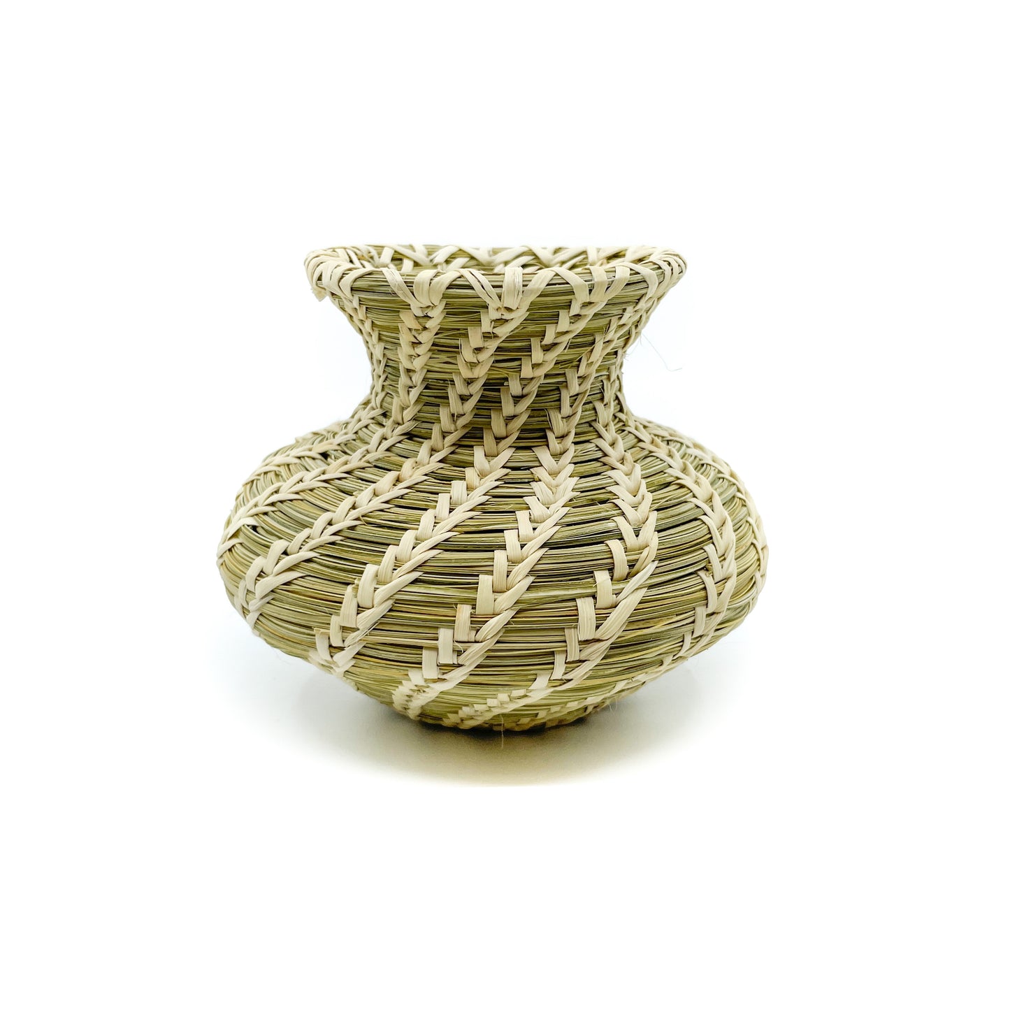 This handwoven olla shaped basket is by Laurie Manuel and measures approximately 4.25 inches in diameter and 3.5 inches high.  Plant materials are hand gathered from the Sonoran Desert for basket weaving. The interior green coils (warp) are native Beargrass and the white stitches (weft) woven around the coils are sun-bleached Soaptree Yucca.