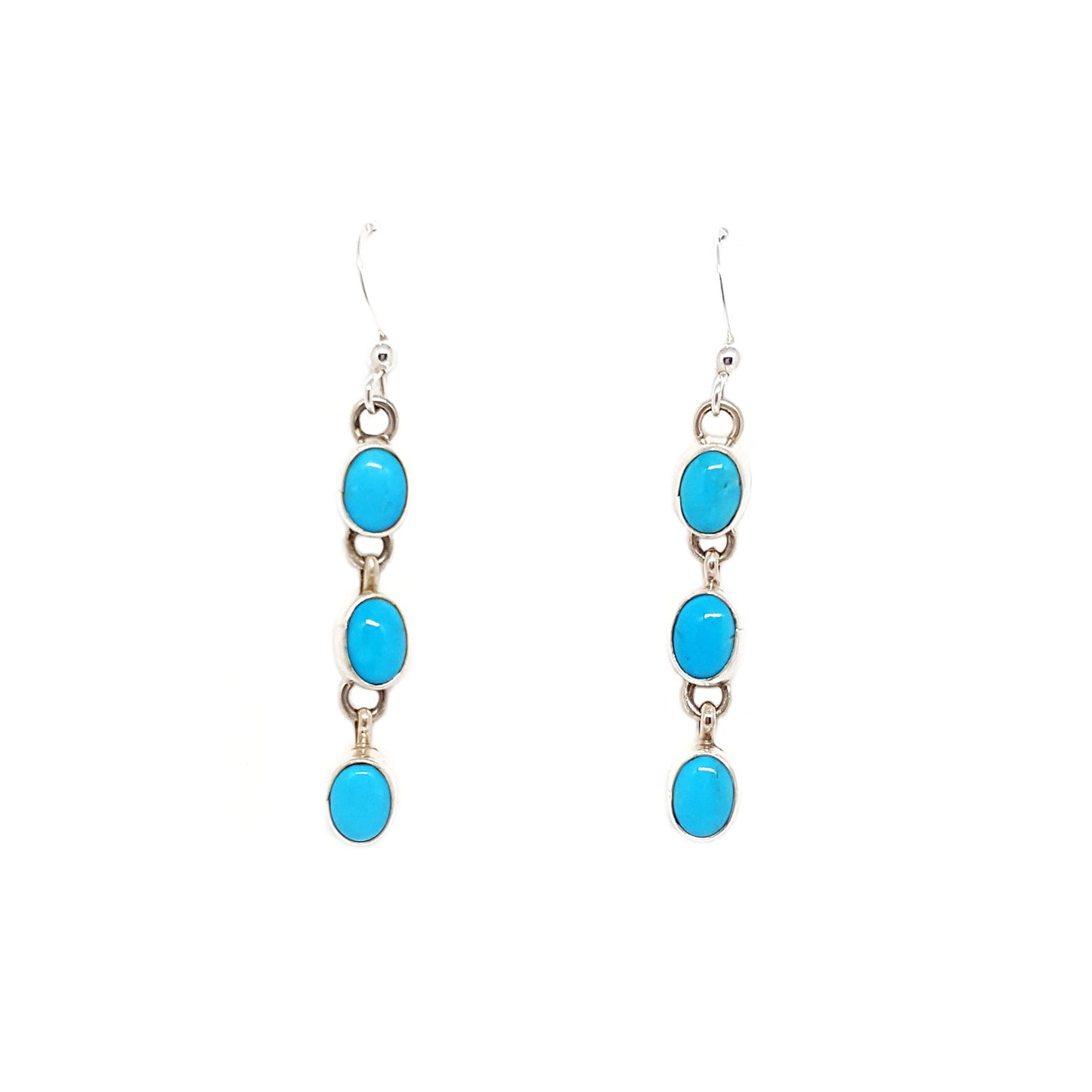 Hand crafted by Diné artist Rose S. Paxton Oval Sleeping Beauty turquoise set in sterling silver bezel Sterling silver French hooks and findings Earrings are approx 2 inches long